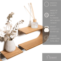 Floating wall mounted sculptural shelf with functional design and manufacturer details