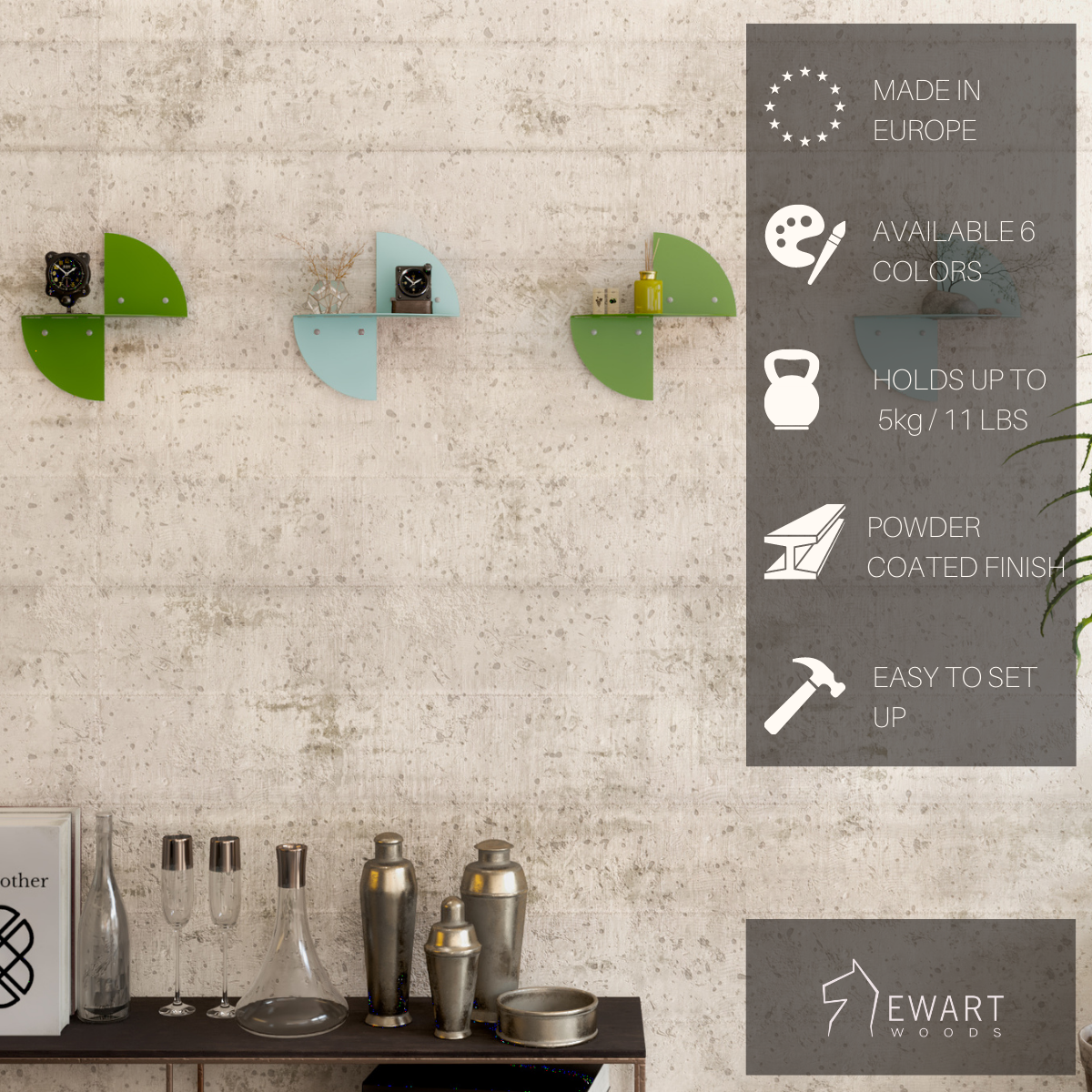 Colorful wall shelves in green and turquoise, attached to a wall with a rustic texture. The image includes icons highlighting key features: Made in Europe, available in 6 colors, holds up to 3 kg (11 lbs), powder-coated finish, and easy to set up. The EWART WOODS logo is displayed.