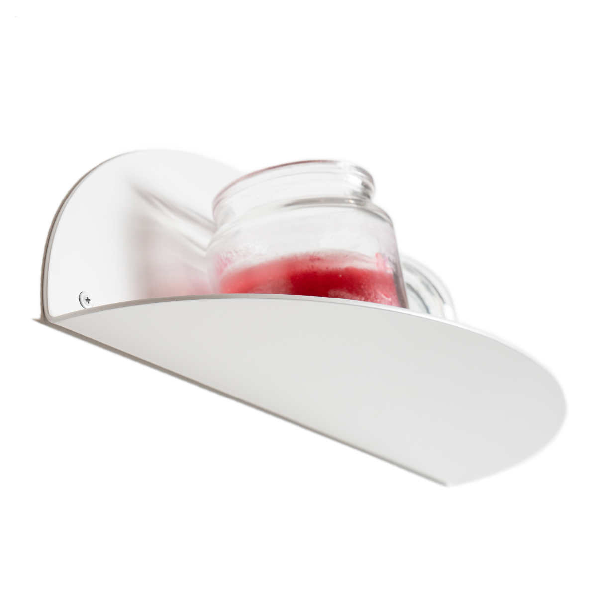 Close-up of a white elliptical metal floating shelf with a candle jar placed on top, showcasing a sleek and minimalist design.