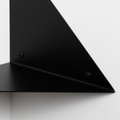 closeup of corner shelf wall mount screws visible white background