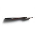 Side view of a dark wooden, floating shelf with a slight curve in the middle, mounted on a white wall. The side edge of the shelf is stained, highlighting the natural wood grain.