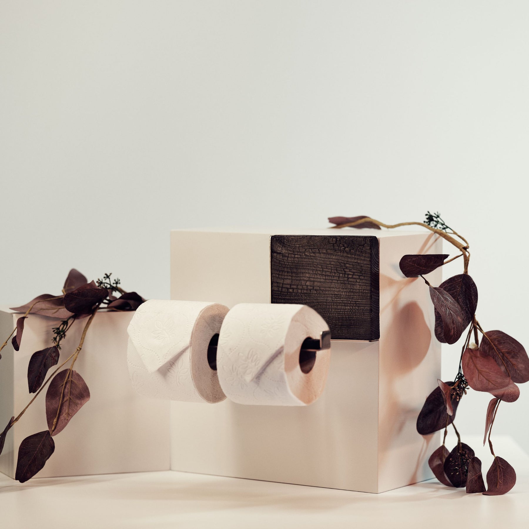 Wall mounted burned wood and metal toilet roll holder