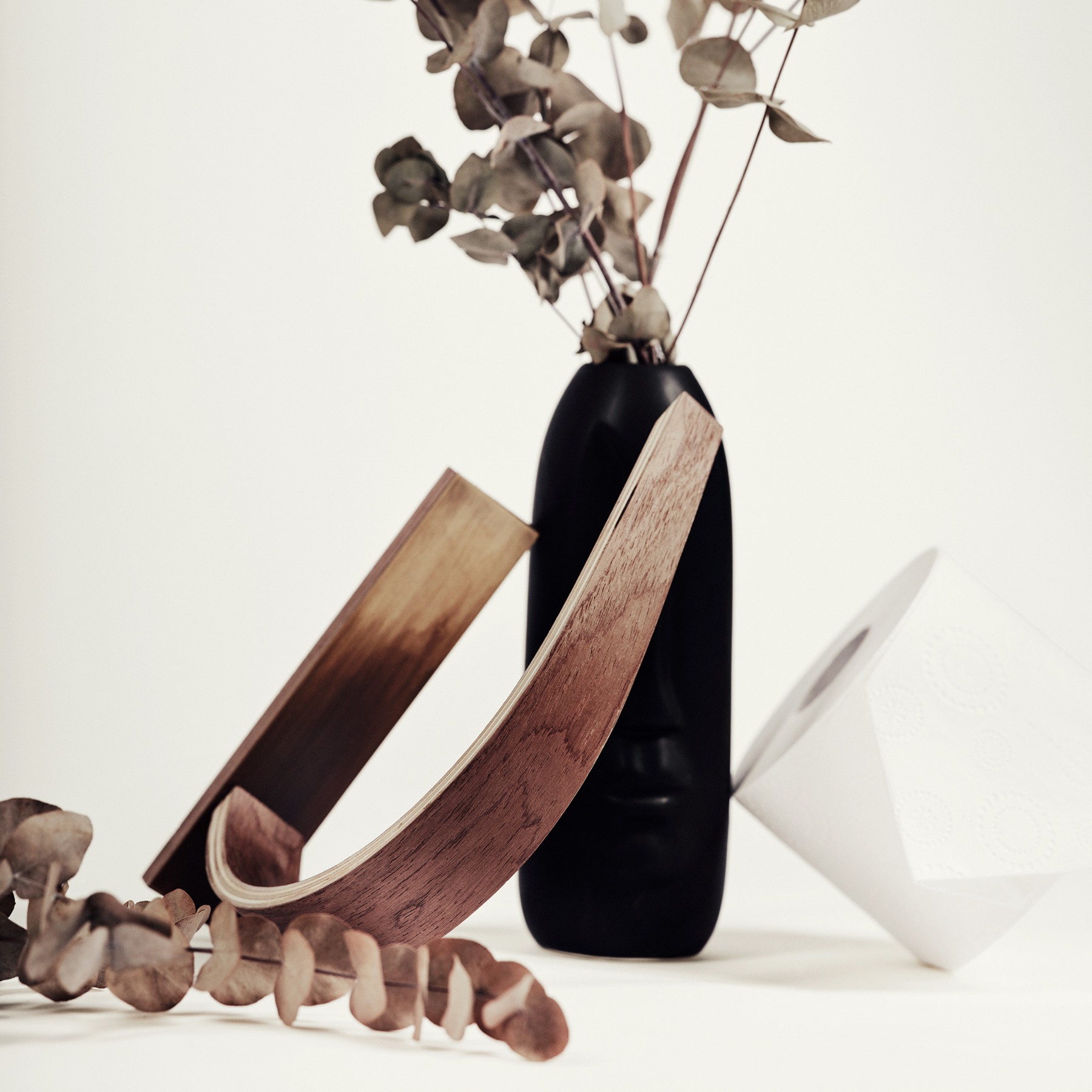 Modern bathroom wooden toilet paper holder with brass design and curved shape compact design