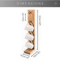 Wooden mug holder with dimensions labeled: 57 cm (22") height, 14 cm (6") width, 10 cm (4") depth, and 12 cm (5") spacing between hooks. Holds three white mugs with a sleek and practical design.