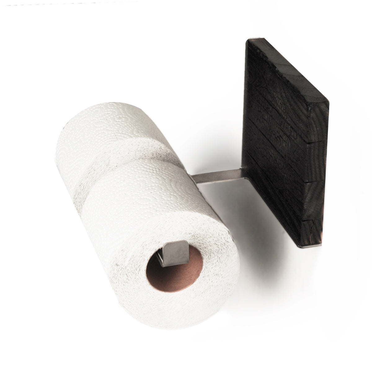 Close-up of a burned ash wood and stainless steel toilet paper holder with two rolls of toilet paper. The design features a sleek metal bar and textured wood