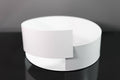 Sleek white metal bowl featuring a minimalist overlapping design, displayed on a glossy black surface for a modern aesthetic.