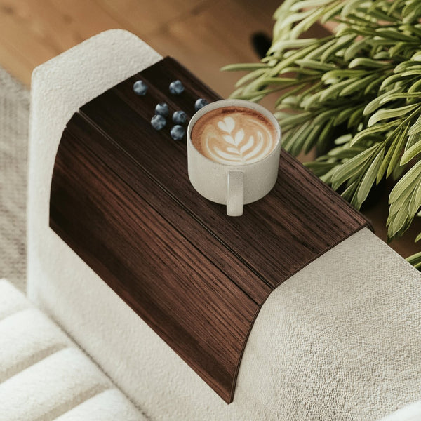 dark brown sofa arm tray on couch armrest with coffe cup and blueberries on