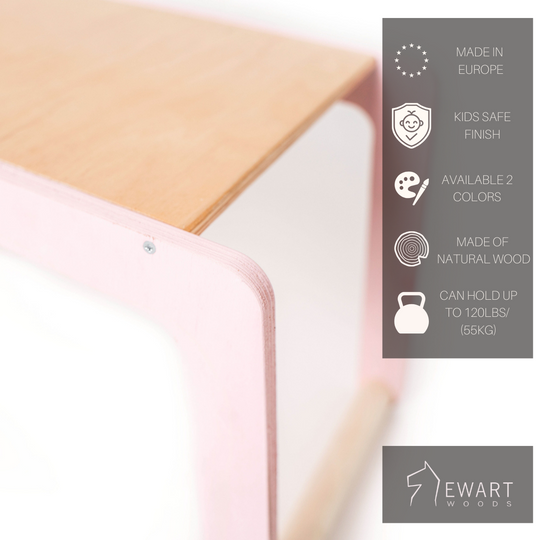 Close-up of a child-sized desk featuring blush pink legs and a light wood surface. The icons highlight its European origin, child-friendly finish, availability in two shades, construction from natural wood, and 120 lbs weight capacity. The &