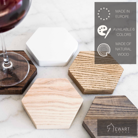 A close-up of a set of hexagonal wooden coasters in various colors, with a glass of red wine placed on one coaster. The text highlights the product&
