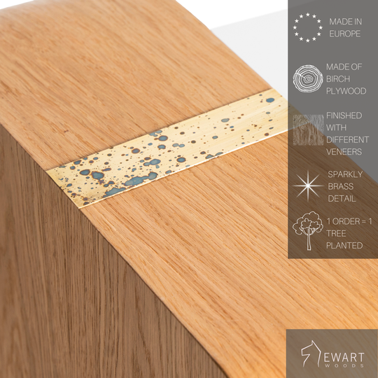 Close-up of modern wooden coffee table with brass accent on top and manufacturer specifics