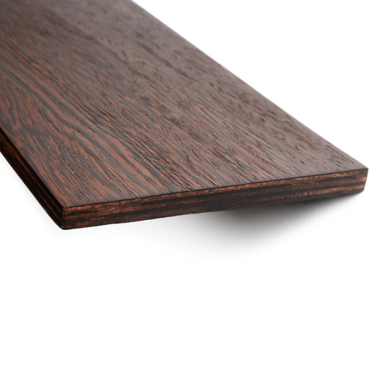 Close-up of a dark wooden shelf, highlighting its detailed grain pattern and sharp, stained edge. The shelf has a polished, smooth surface.