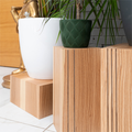 Different vertical groove designs for wood cube plant stands