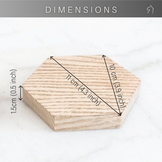Hexagonal wooden coaster with dimensions highlighted: 11 cm (4.3 inches) across the widest point, 10 cm (3.9 inches) from corner to corner, and 1.5 cm (0.5 inches) thick.