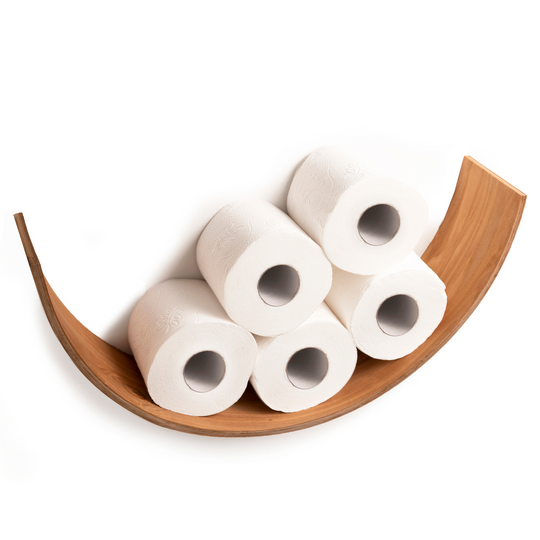 Front view of a curved wooden toilet paper holder displaying five rolls of toilet paper. The holder is made of light wood, offering a sleek and minimalist design.