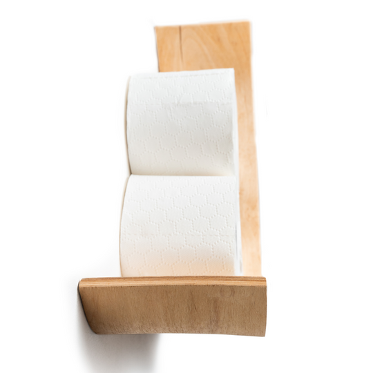 Top view of an ash wooden shelf holding two rolls of toilet paper, with a clean, minimalist design showcasing the smooth edge of the shelf.