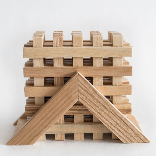 Wooden coasters in a pyramid holder, featuring a handcrafted lattice design with natural wood grain for a warm, rustic touch.