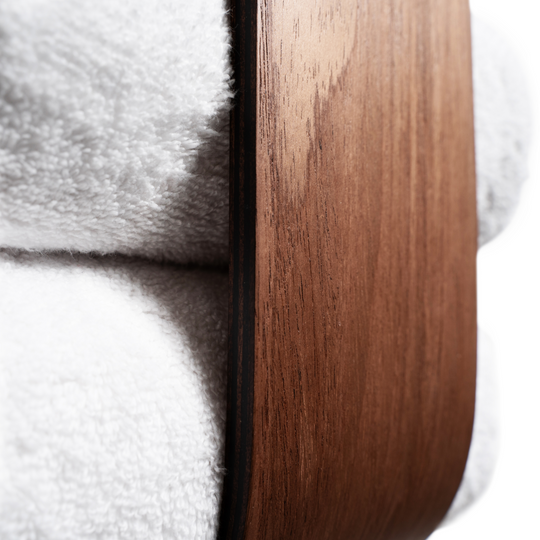Close-up of wooden towel holder showcasing its smooth veneer texture and rich wood grain, emphasizing craftsmanship and elegance. Neatly stores towels while adding style and functionality.