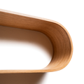Geometric floating shelf wall mounted wooden curved edge close-up