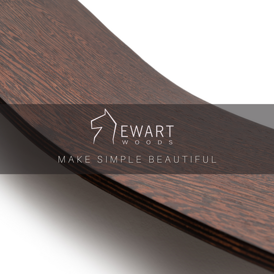 Close-up of a dark wooden shelf with a curved middle. Overlaid text reads &