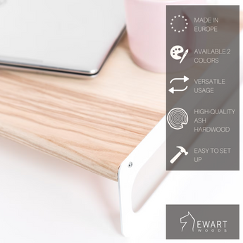 Wooden serving tray with a light ash finish and sleek white metal legs. The tray is shown with a laptop and features overlayed text highlighting key features: Made in Europe, available in 2 colors, versatile usage, high-quality ash hardwood, and easy to set up, with the 'EWART WOODS' logo.