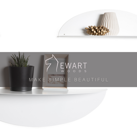 Two white elliptical metal floating shelves displaying decorative items like a potted plant, photo frame, and a vase, with the &