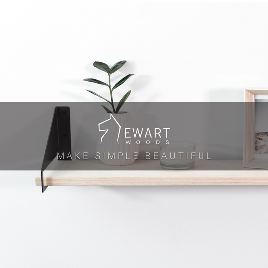 Front view of wooden shelf with geometric metal brackets by EWART WOODS