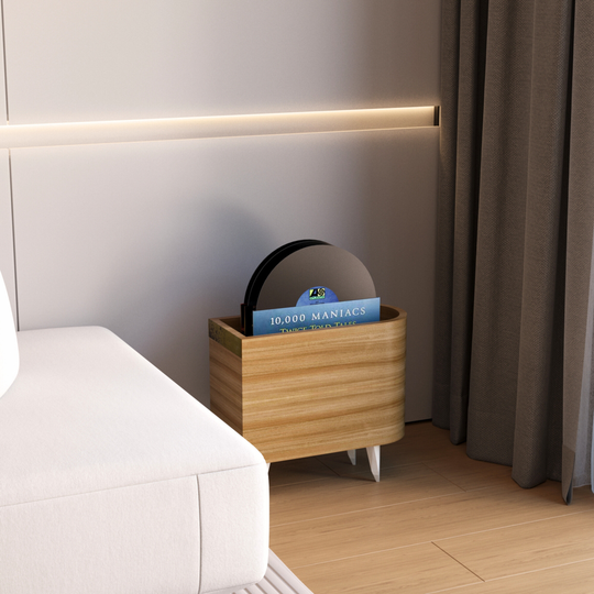 Side view of wooden vinyl record storage with brass plate on front 