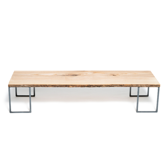 Wooden monitor stand with tree bark and metal legs for office organisation