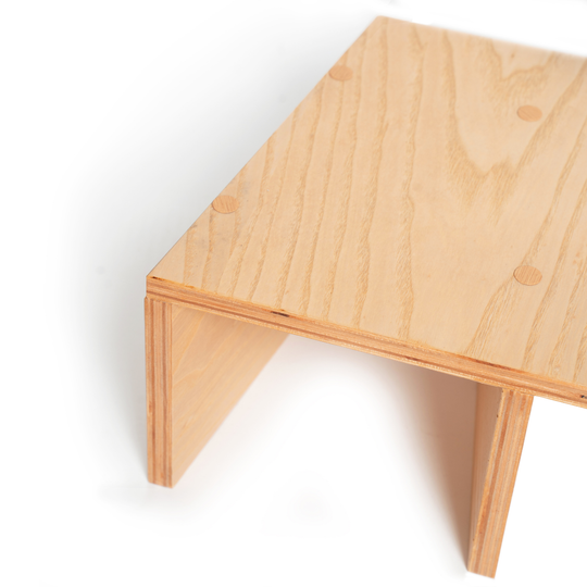 Close-up of wooden monitor stand for desk