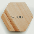 Hexagonal wooden key holder with a natural wood grain pattern, labeled &