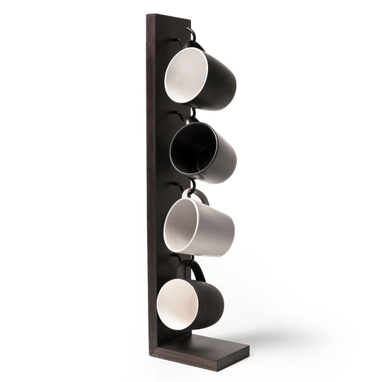 Freestanding wooden mug holder with hooks, holding four mugs in alternating light and dark tones, showcasing a minimalist and practical design.