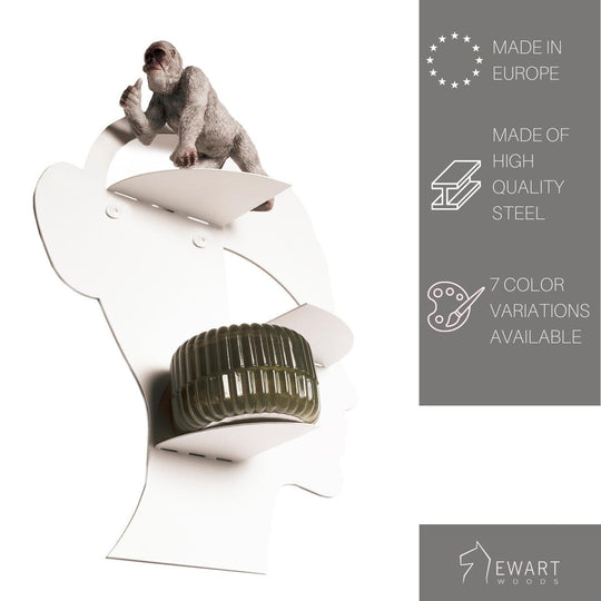 Unique white wall shelf shaped like a face with three floating shelves, featuring a playful monkey sculpture on top, made of high-quality steel with 7 color variations available