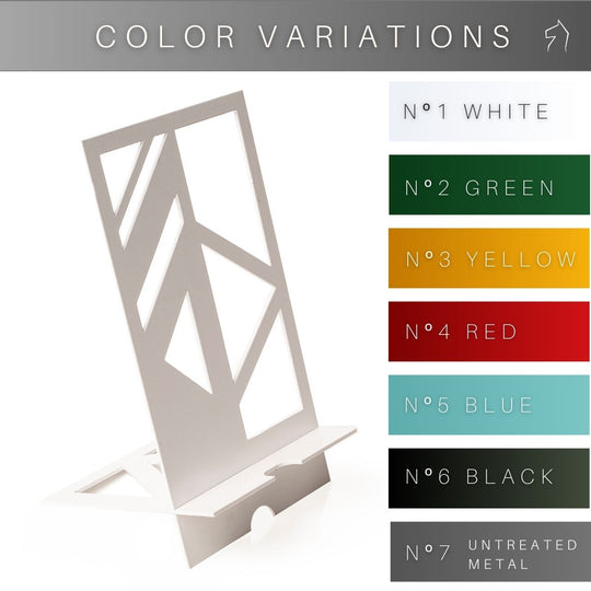 A sleek metal phone holder with a white geometric cutout design, displayed alongside a list of available color options: white, green, yellow, red, blue, black, and untreated metal.