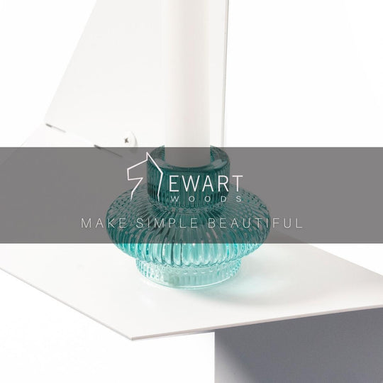 Close-up of white floating wall metal shelf in geometric shape