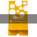 Yellow metal phone holder with circular cutout patterns, overlaid with the Ewart Woods logo and the slogan &