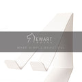 A sleek white minimalist phone holder shown from a side angle, with the Ewart Woods logo and the slogan &