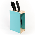 Teal-colored knife block with a wooden top and base, holding three black-handled knives. The knife block features a side slot for additional storage and is displayed against a white background.