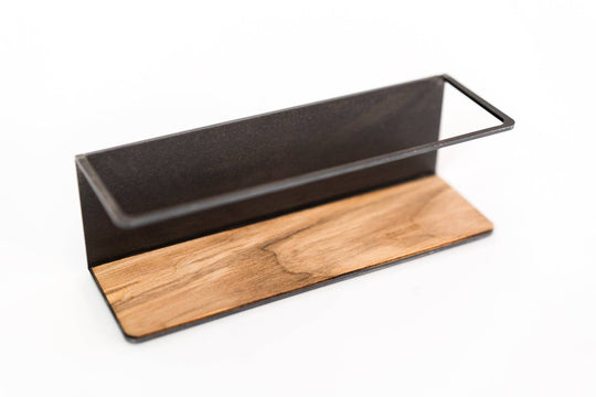 Storage rack with a sleek black metal frame and a textured wooden base, offering a stylish and functional way to organize spices or small items in your kitchen.