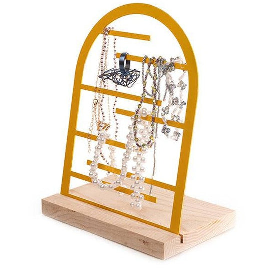 Yellow arch-shaped jewelry stand with horizontal bars, showcasing various necklaces and accessories on a wooden base.