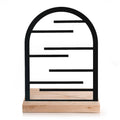 Black arched jewelry holder with horizontal bars on a wooden base, designed for organizing accessories.