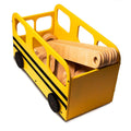 Yellow wooden toy bus with black wheels, filled with a wooden balance beam set, resembling a school bus.