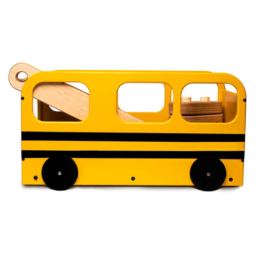 Wooden school bus toy box in yellow and black, featuring cut-out windows and functional wheels, with balance beam pieces neatly stored inside.