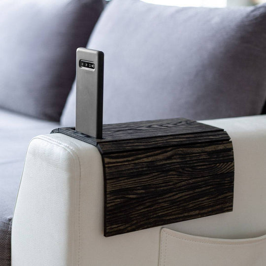 Burned Wooden Sofa Arm Tray Table on a couch arm, showcasing its versatility and stylish burnt wood finish. EWART WOODS